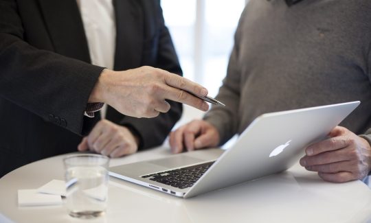 a business investor talking to a businesswoman