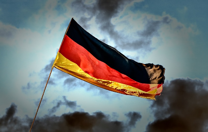 German flag under partly cloudy sky